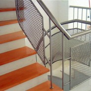 Railing with protective mesh